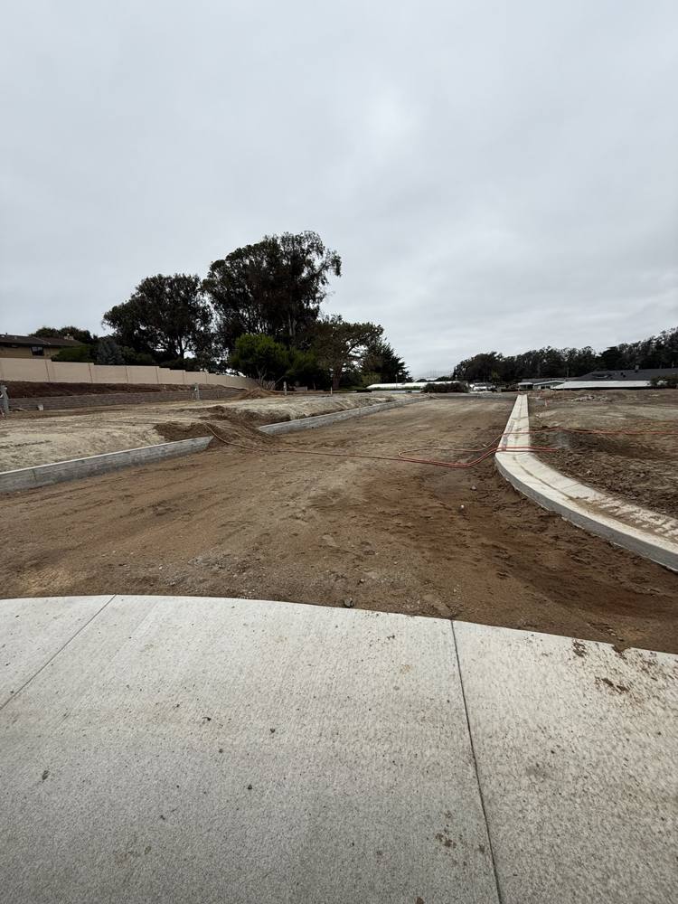 New asphalt roadway and rolled curb at Morro Shores